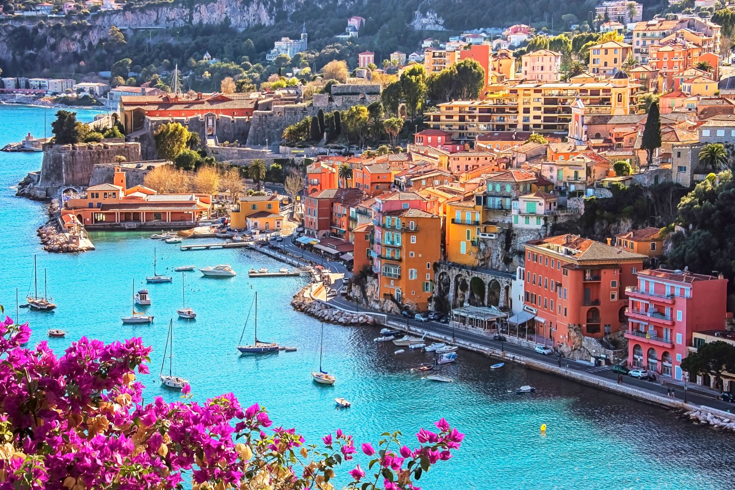 A scenic European coastline and hillside town